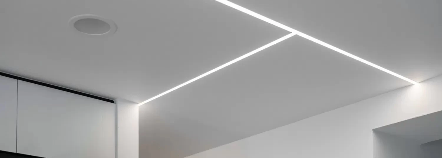 4x8 PVC ceiling sheet installed in a modern residential kitchen showing smooth white surface finish with recessed lighting and tongue and groove joint lines that are invisible from standing height 4x8 PVC ceiling sheet installed in a modern residential kitchen showing smooth white surface finish with recessed lighting and tongue and groove joint lines that are invisible from standing height